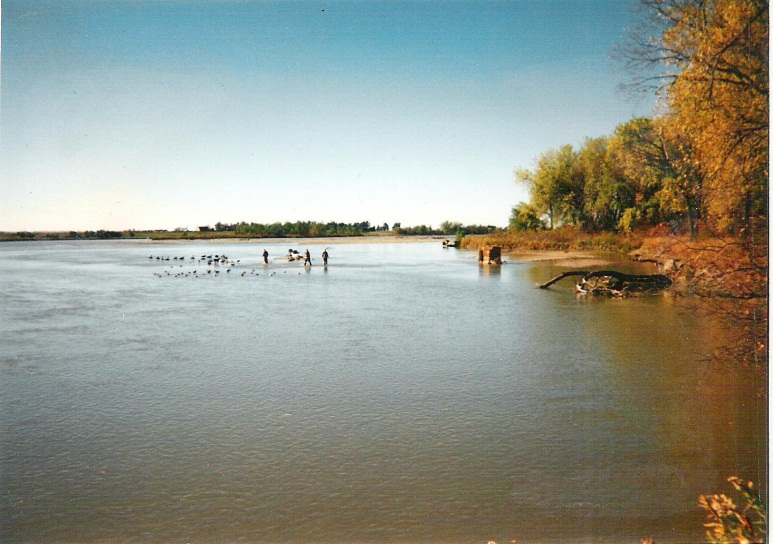 A typical decoy set-up when the water level of the Platte River was low.  A pontoon blind is anchored in the water.