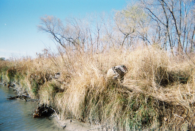 Hunting club member taking a nap alongside the riverbank of the Platte River at the KMS hunting site.