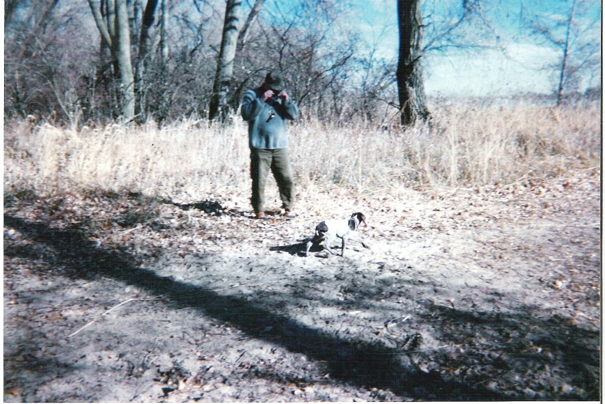 L. to R.: John “E” Ellis, and Gracy walking about the KMS hunting site.